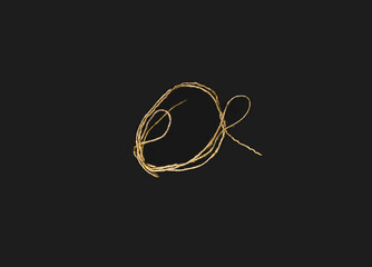 Brightly colored threads arranged on a black background.