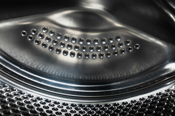Stainless metal surface of the washing machine drum.inner metal drum of the washing machine - obrazy, fototapety, plakaty