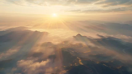 Fotobehang Beautiful aerial View of hilly landscape in morning mist with sun rays, banner format  © Ziyan