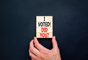 I voted. Did you symbol. Concept words I voted. Did you on beautiful wooden block. Beautiful black table black background. Voter hand. Business I voted. Did you concept. Copy space.