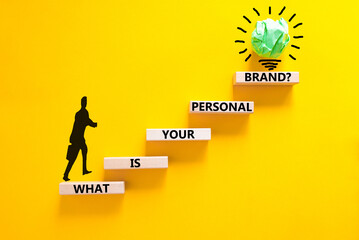 What is your personal brand symbol. Concept words What is your personal brand on wooden blocks. Beautiful yellow background. Businessman icon. Business what is your personal brand concept. Copy space.