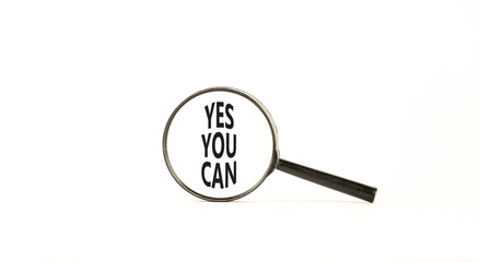 Motivational Yes you can symbol. Concept words Yes you can in beautiful magnifying glass. Beautiful white table white background. Business motivational and Yes you can concept. Copy space