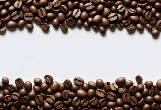 Roasted coffee beans scattered at the top and bottom of the picture, with a white area in the middle