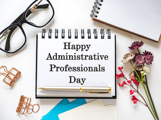 Happy Administrative Professionals Day. Notepad with congratulatory inscriptions. Close-up. Finance...
