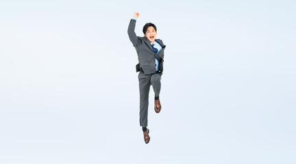 Fototapeta na wymiar ジャンプする若いビジネスマンの全身写真