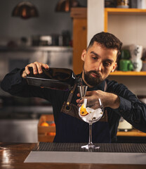 Professional barman using jigger