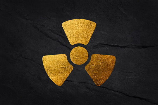 Gold biohazard symbol isolated on black background with clipping path.