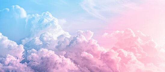 Pastel Dreams Soft Cloudscape in a Pink Palette Dissolving into a Bright Sky Blue Horizon