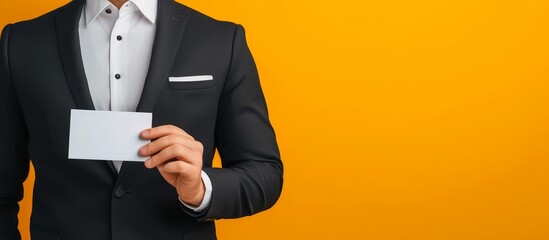 Professional businessman in formal suit displaying elegant business card