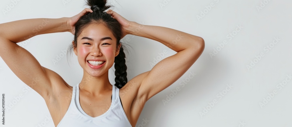 Sticker confident young woman with ponytail posing for a photo shoot in a sunny park