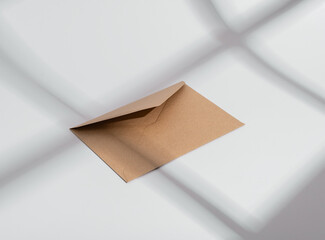 Craft paper envelope. Letter, mail, post, communication and correspondence concept. Sunlight