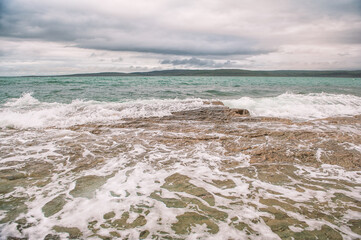Sea waves in storm and dramatic clouds