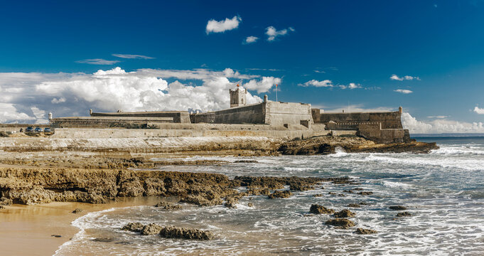 The San Julian (São Julião) lighthouse, located in the fort of the same name, and situated on a headland on the north bank of the River Tagus estuary in Oeiras, Lisbon District, Portugal.