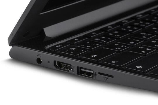Close-up of laptop showing connecting port isolated on white background