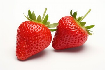 Two strawberries close up on white background