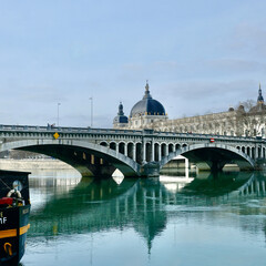 Famous french "Grand hotel dieu" building with the Wilson Bridge in the foreground in Lyon.