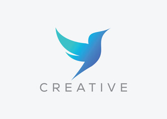 Fototapeta na wymiar Creative and minimal bird vector logo design template. Dove Flying logo. Pigeon vector