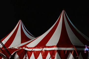 Circus tent illuminated at night. Festive attraction in the city