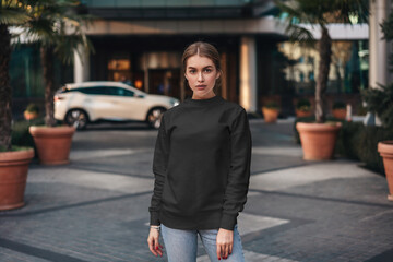 Fototapeta premium Woman blank sweatshirt mockup with model
