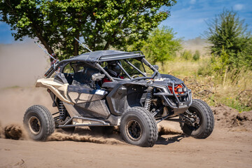 UTV vehicle offroad kicking up sand on dune. Extreme, adrenalin. 4x4.