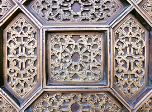 close up details of a traditional Moroccan copper and metal door at the Mohammed V mausoleum in Rabat Morocco