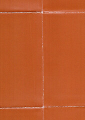 orange paper texture with several folding marks, retro paper surface, poster or cover overlay.