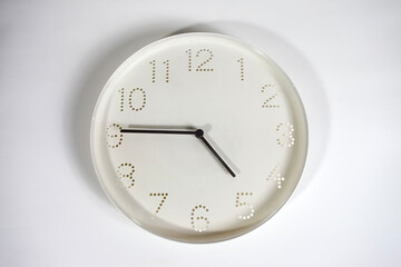 White wall clock isolated on a white background