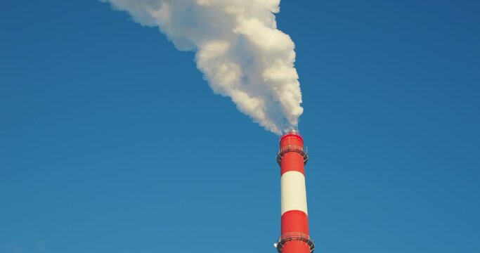 4K - Heavily smoking factory chimney