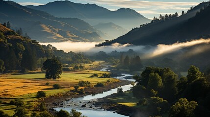 A serene mountain valley at dawn, mist rising from the meadows, rugged peaks in the background bathe - obrazy, fototapety, plakaty