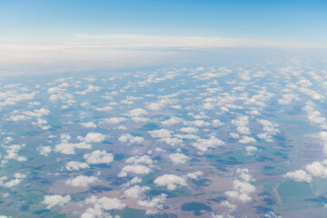 the sky with clouds in the window of the plane