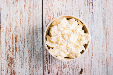 Close up of traditional mascarpone cheese in a bowl on the table top view