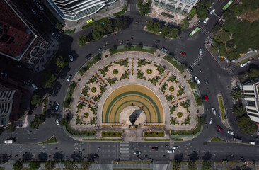 Saigon Vietnam traffic roundabout top down aerial photo. City buildings , and park  can be seen.  Ho Chi Minh City center on sunny clear day. Close up.
