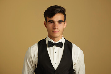 Classic Portrait of Young Man in Tuxedo: Ideal for Formal Event Promotions and Fashion Editorials