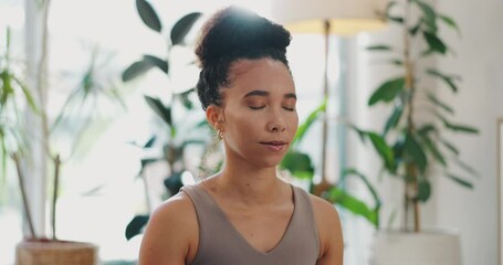 Meditation, woman and breathing in home for health, wellness and care in living room. Calm, relax and peace of a African female person in a lounge with spiritual practice in a house for zen