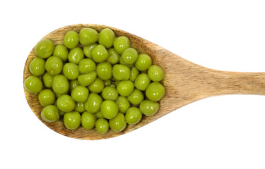 Boiled green peas in wooden spoon isolated on white, top view