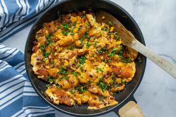 Fried potatoes with chorizo sausage, cheddar cheese and eggs