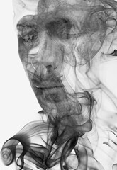 A double exposure male portrait combined with a smoke swirl texture - 739350497