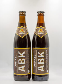 Dunkel ABK German dark beer bottles closeup on white.