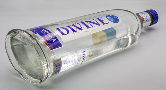 Studio shoot of Divine French vodka bottle closeup against white.
