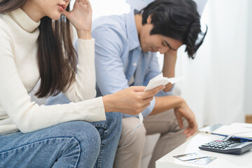 Family financial concept, Stressed wife and husband have a problem to pay loan can not pay credit card debt.