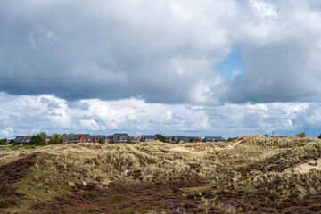 Dünenlandschaft auf der Norseeinsel Amrum mit dramatischen Wolken - 739361857