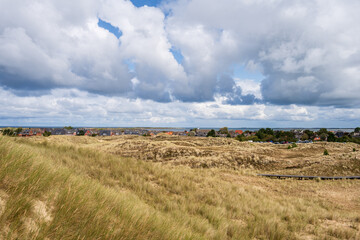 Dünenlandschaft auf der Nordseeinsel Amrum mit Blick auf Norddorf bis zur Nachbarinsel Föhr