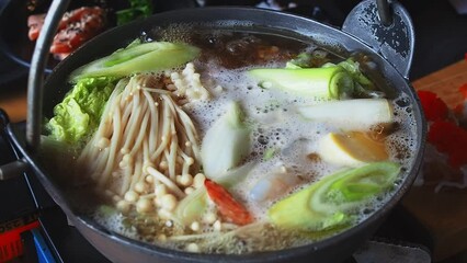 Nabe, Shabu-shabu, Sukiyaki Japanese food. Hot pot. Nabe is boiling in a hot pot.Japanese food in Thai style.