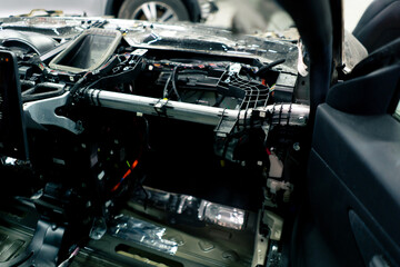 close-up of a disassembled part of a car before a complete repair after an accident at service station