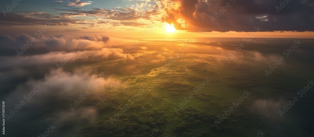 Poster captivating view of a mesmerizing sunset over the calm ocean with fluffy clouds