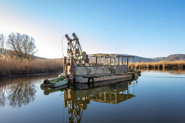
dredge boat abandoned in a swamp in colfiorito lagoon in umbria italy
