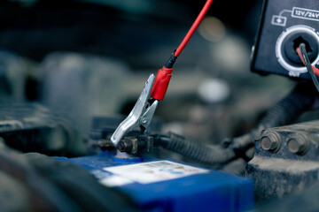Fototapeta premium close-up of part of a battery at a service station to which power is supplied for recharging
