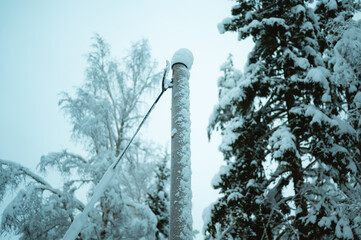 Electricity pole after a snowstorm, Sweden