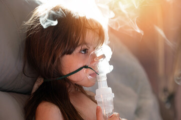 Caucasian girl kid with inhaler mask