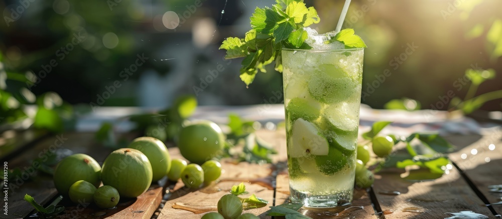 Poster Refreshing glass of zesty limeade with a straw and a slice of lime on a rustic wooden table